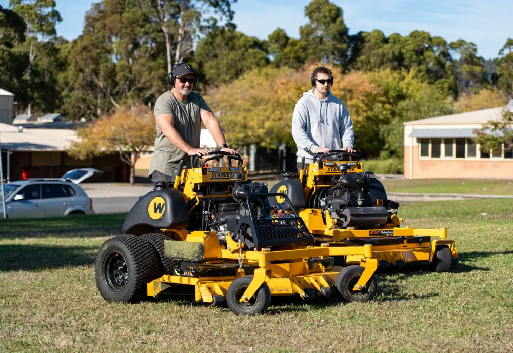 Professional grounds maintenance creating neat, tidy lawns at a school, business park, and residential property